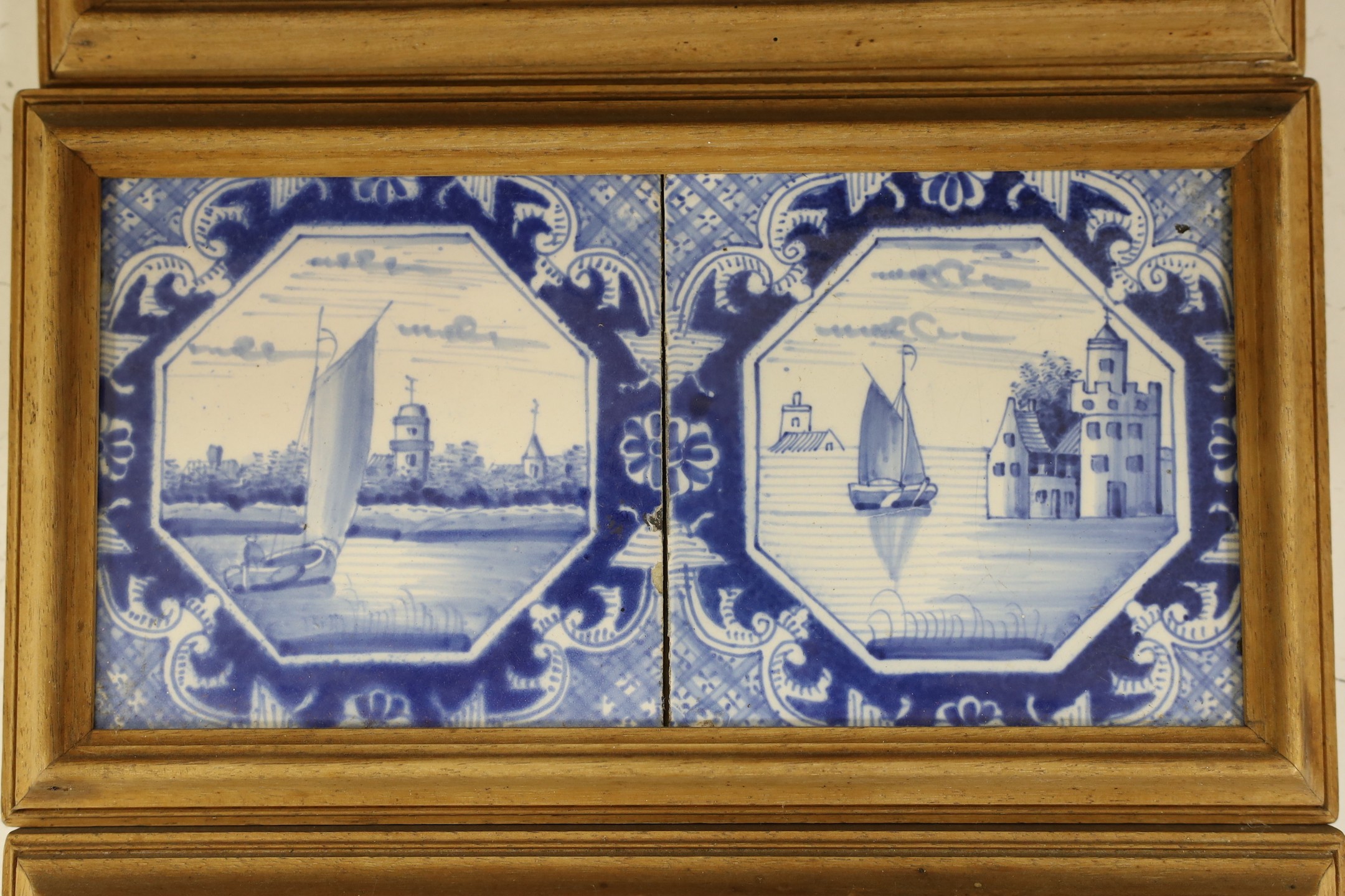 Three pairs of Delft blue and white ‘landscape’ tiles, 18th/19th century, in double frames